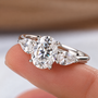 2 Carat Oval Cut Moissanite Ring with Pear Cut Side Stones