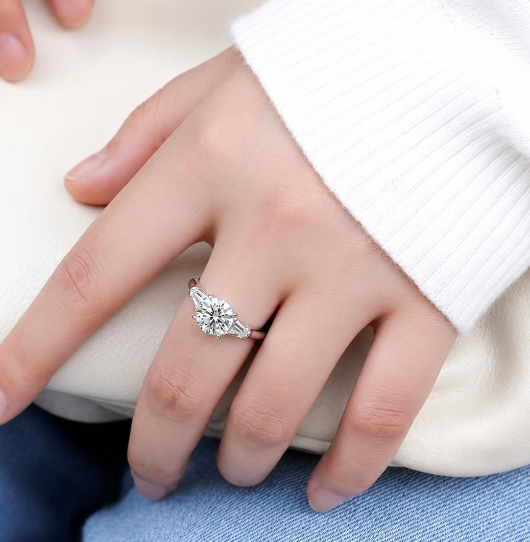 Round Cut Moissanite Ring with Tapered Baguette Side Stones