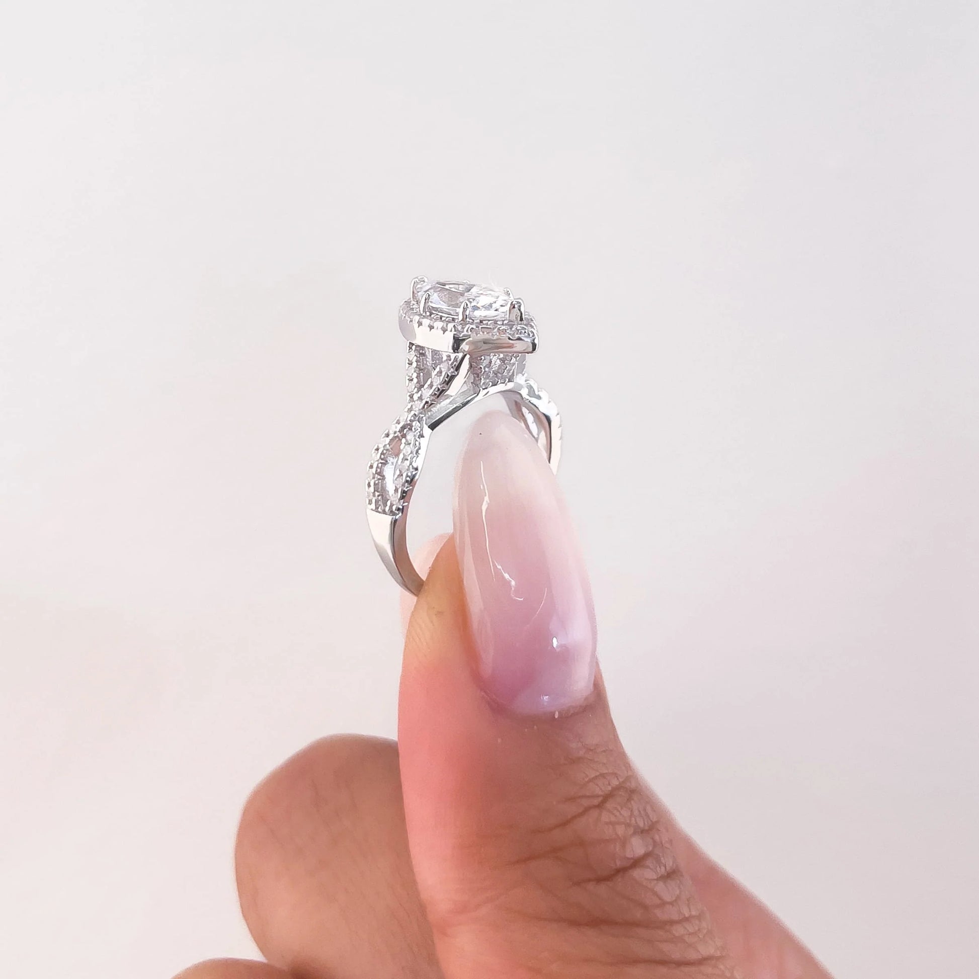 Twisted Marquise Cut Halo Moissanite Ring